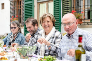 Senior couples at outdoor family lunch, Florence, Italy Senior couples at outdoor family lunch, Florence, Italy